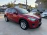 2016 Red /Black Mazda CX-5 Touring (JM3KE2CY5G0) with an 2.5L L4 DOHC 16V engine, 6A transmission, located at 1501 West 15th St., Houston, 77008, (713) 869-2925, 29.797941, -95.411789- Photo#2