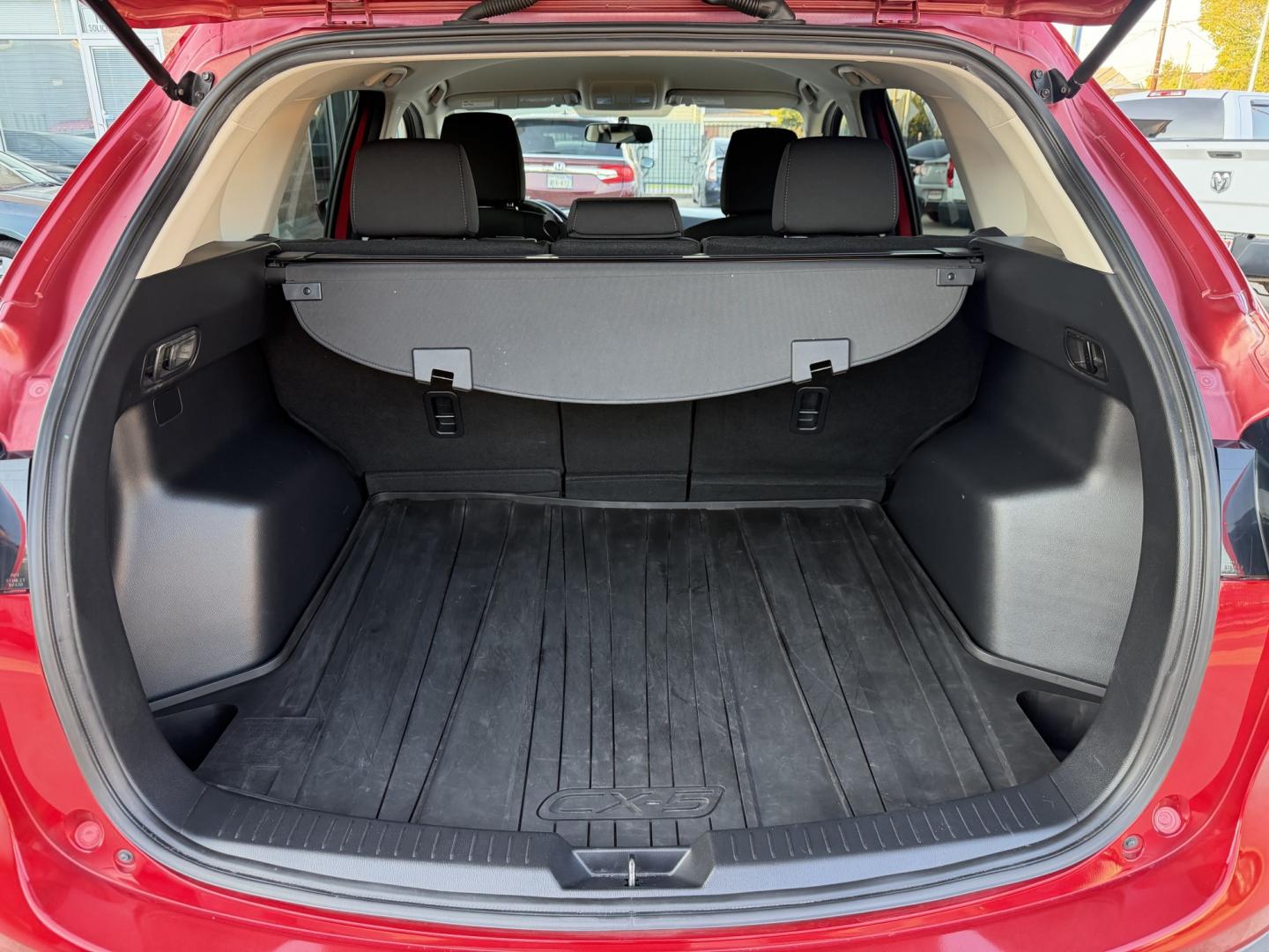 2016 Red /Black Mazda CX-5 Touring (JM3KE2CY5G0) with an 2.5L L4 DOHC 16V engine, 6A transmission, located at 1501 West 15th St., Houston, 77008, (713) 869-2925, 29.797941, -95.411789- Photo#4
