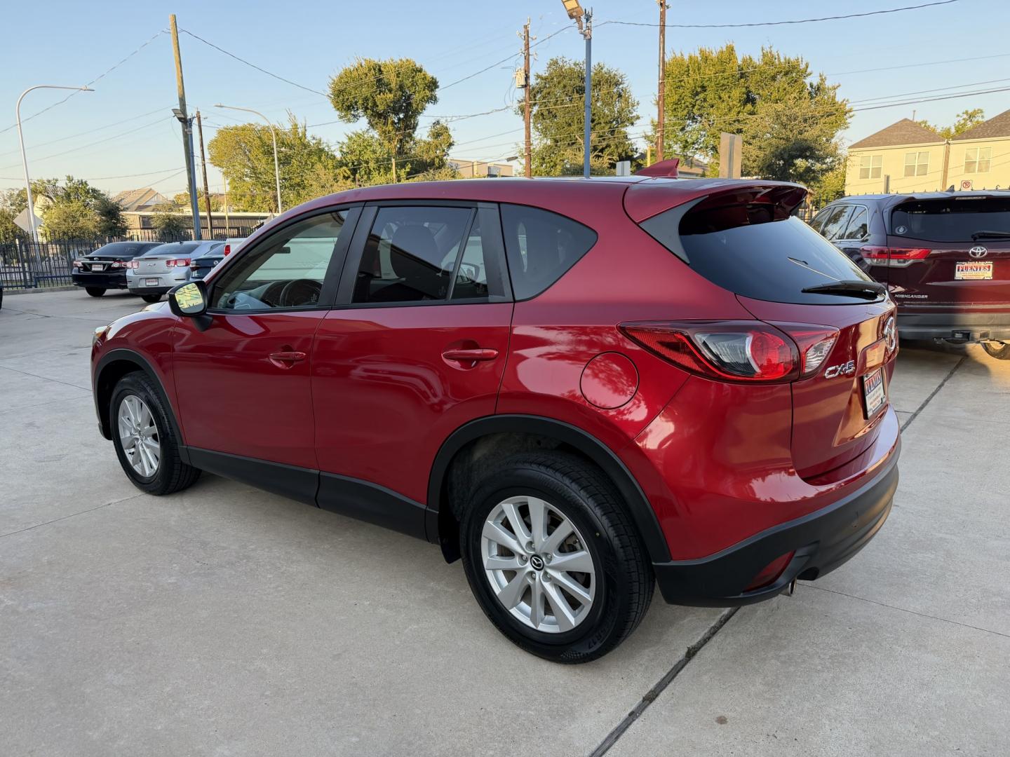 2016 Red /Black Mazda CX-5 Touring (JM3KE2CY5G0) with an 2.5L L4 DOHC 16V engine, 6A transmission, located at 1501 West 15th St., Houston, 77008, (713) 869-2925, 29.797941, -95.411789- Photo#5