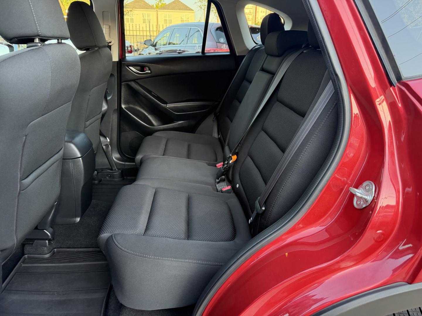 2016 Red /Black Mazda CX-5 Touring (JM3KE2CY5G0) with an 2.5L L4 DOHC 16V engine, 6A transmission, located at 1501 West 15th St., Houston, 77008, (713) 869-2925, 29.797941, -95.411789- Photo#7