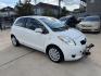 2008 White /Black Toyota Yaris Liftback (JTDJT923185) with an 1.5L L4 DOHC 16V engine, 5 Speed manual transmission, located at 1501 West 15th St., Houston, 77008, (713) 869-2925, 29.797941, -95.411789- Photo#3