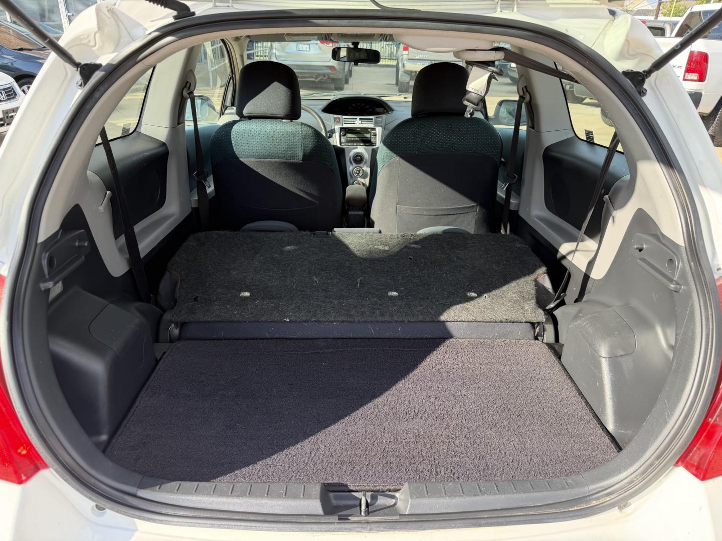 2008 White /Black Toyota Yaris Liftback (JTDJT923185) with an 1.5L L4 DOHC 16V engine, 5 Speed manual transmission, located at 1501 West 15th St., Houston, 77008, (713) 869-2925, 29.797941, -95.411789- Photo#10